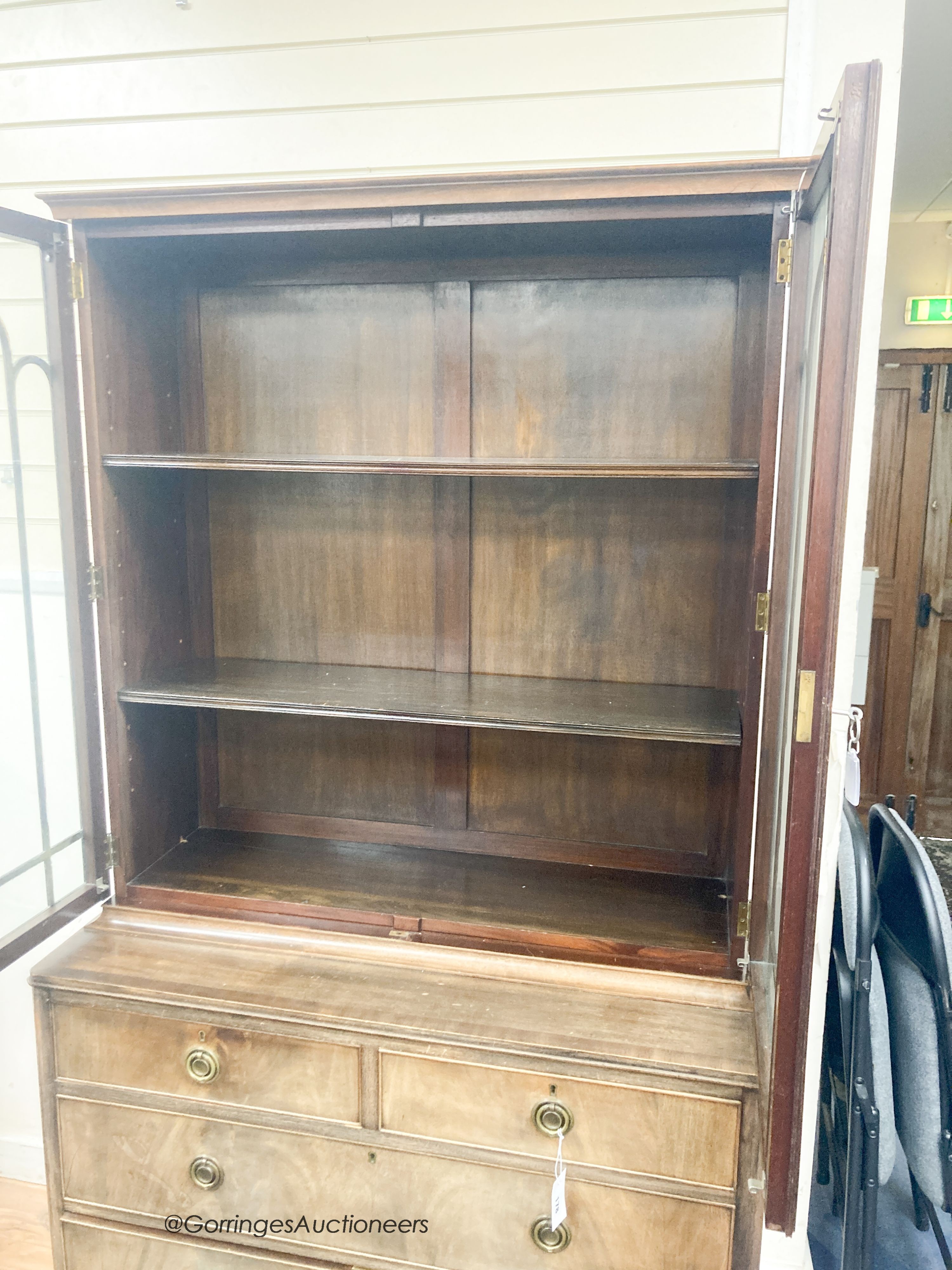 A George III style banded mahogany cabinet on chest, length 106cm, depth 48cm, height 191cm